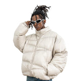 Model wearing front view solid color oversized stand collar zipper padded jacket.