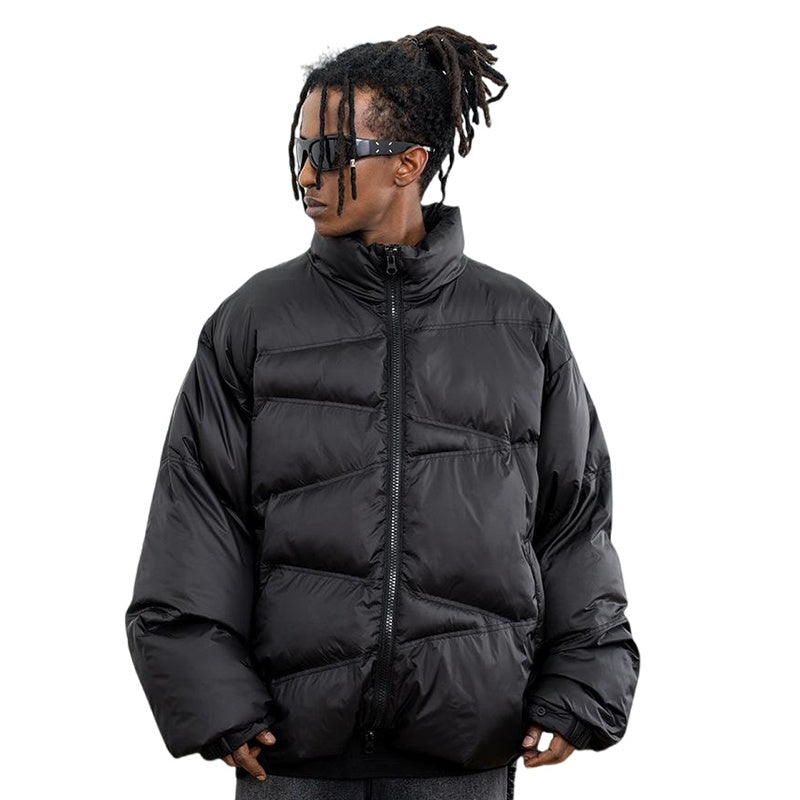 Model wearing front view solid color oversized stand collar zipper padded jacket.