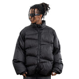 Model wearing front view solid color oversized stand collar zipper padded jacket.