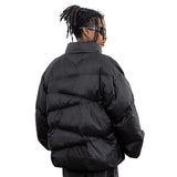 Model wearing back view solid color oversized stand collar zipper padded jacket.