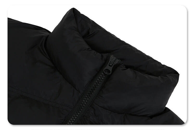 Stand collar detail of solid color oversized stand collar zipper padded jacket.