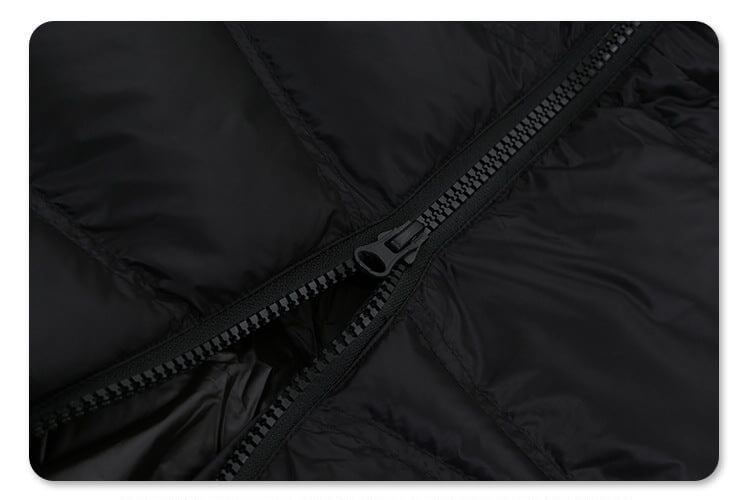 Zipper detail of solid color oversized stand collar zipper padded jacket.