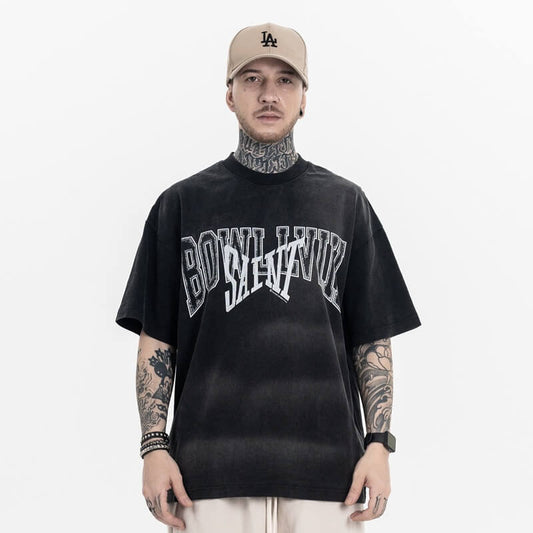 Model wearing Vintage Letter Black Graphic T-Shirt, front view.