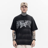 Model wearing Vintage Letter Black Graphic T-Shirt, front view.
