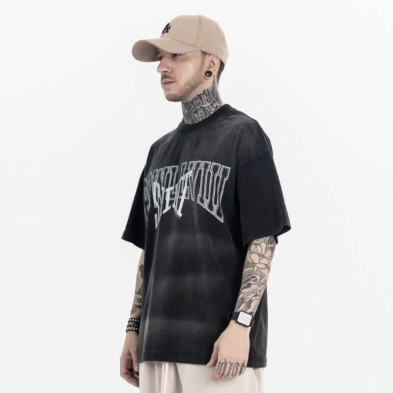 Model wearing Vintage Letter Black Graphic T-Shirt, side view.