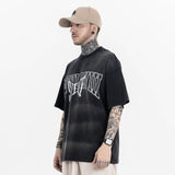 Model wearing Vintage Letter Black Graphic T-Shirt, side view.