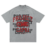 Flat lay of light grey vintage letter graphic t-shirt on display.
