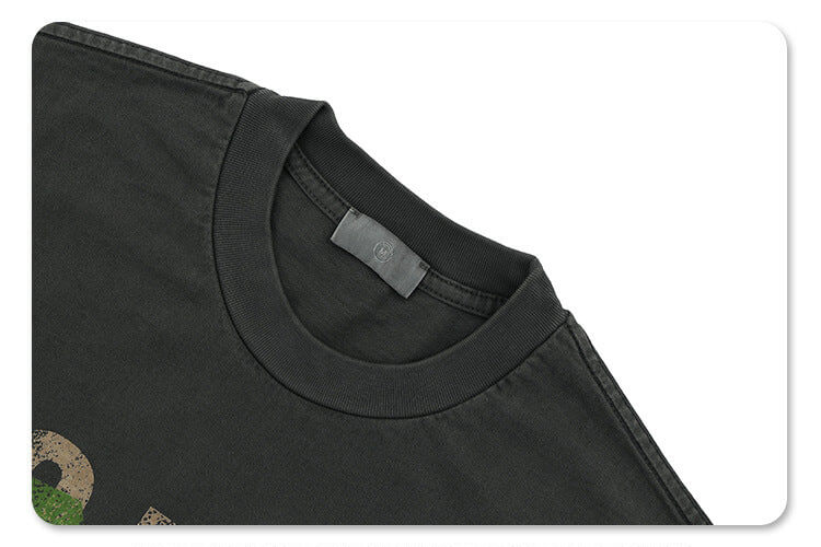 Close-up of neckline detail on vintage letter graphic t-shirt.