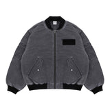 Flat lay of vintage ma1 bomber padded jacket front view.