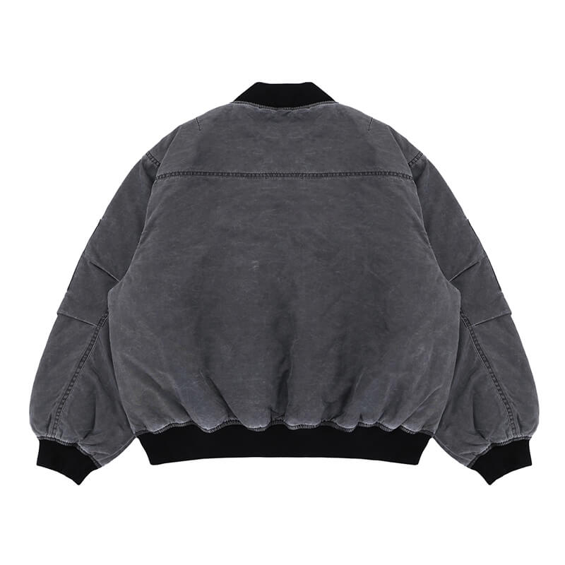 Flat lay of vintage ma1 bomber padded jacket back view.