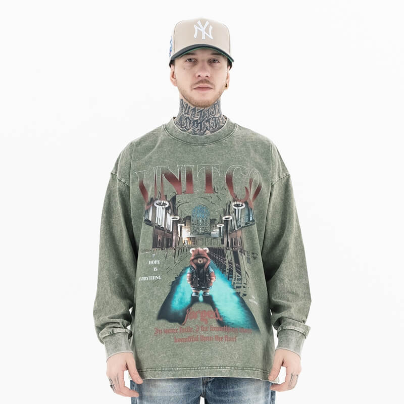 Army green vintage wash bear alphabet long sleeve graphic t-shirt worn by model front view.