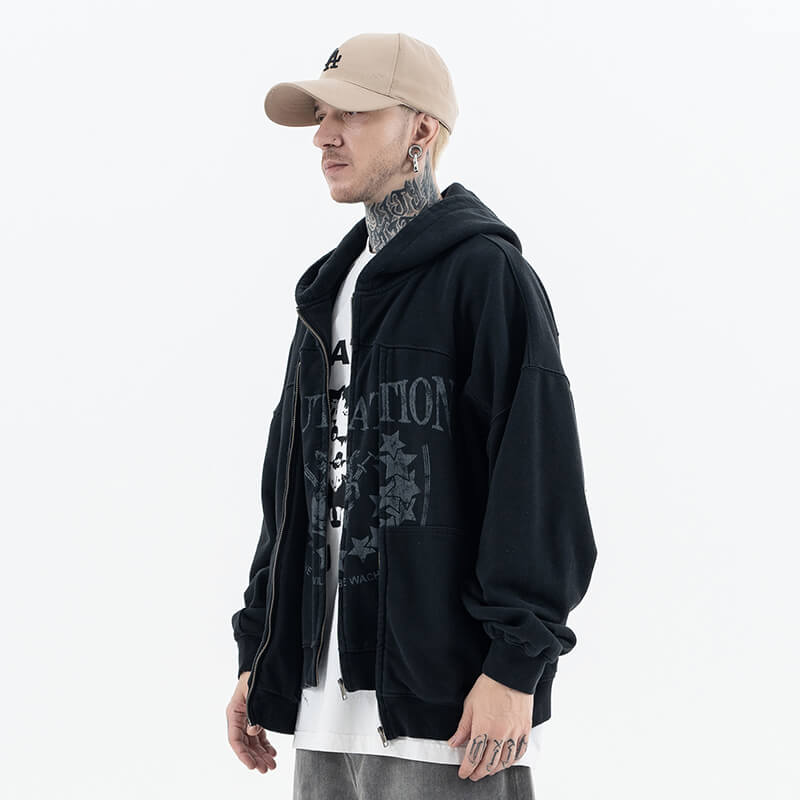 Model wearing side view of vintage wash cardigan double zipper graphic hoodie.
