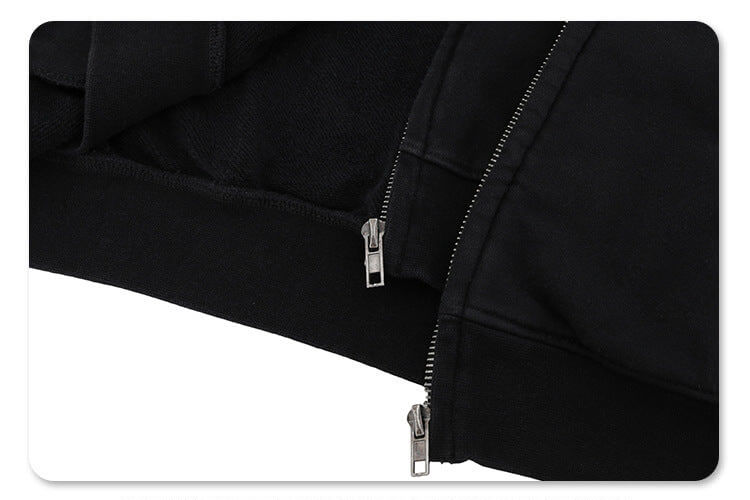 Close-up of double zipper details on vintage wash cardigan graphic hoodie.