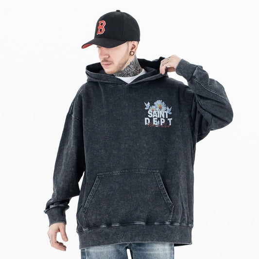 Model wearing front view of vintage wash saint hoodie.
