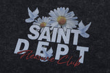 Close-up of vintage wash saint hoodie graphic details.