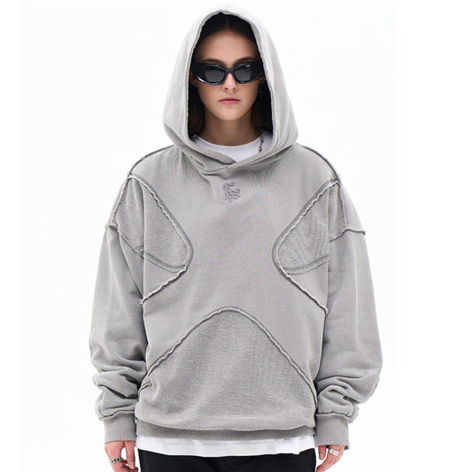 Model wearing vintage washed deconstructed minimalist letter fg graphic hoodie front view.