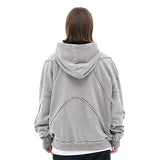 Model wearing vintage washed deconstructed minimalist letter fg graphic hoodie back view.