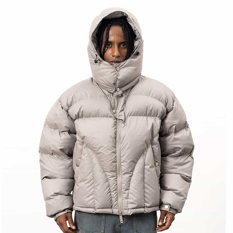 Model wearing front view winter hooded multifunctional warm padded jacket.